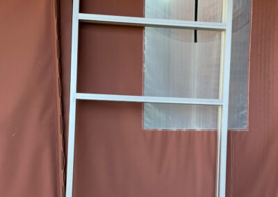 Window frame leaning against a wall at the Aurora West Bend facility