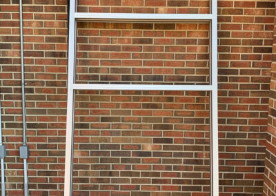 Window frame leaning against a wall at the Aurora West Bend facility