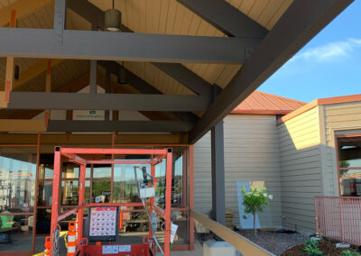 Lift vehicle parked under canopy at the Aurora West Bend facility