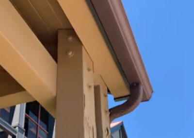 Damaged wood beams by the gutter at the Aurora West Bend facility