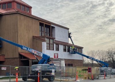 Beeler employees in lift vehicles working at the Aurora West Bend facility