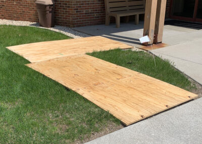 Plywood covers protecting the grounds at the Aurora West Bend facility