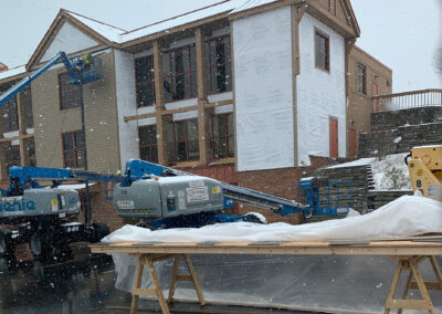 Beeler employees working at the Aurora West Bend facility during a snow fall