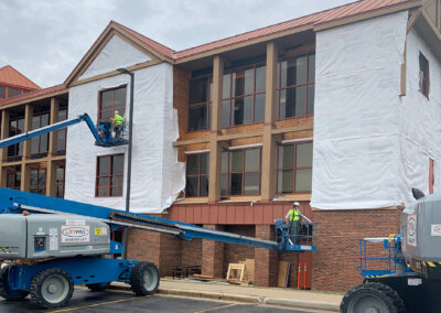 Beeler employees working on the exterior of the Aurora West Bend facility