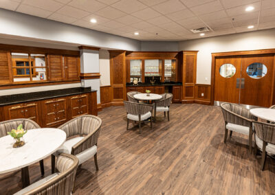 Dining room space from Avalon Square featuring tables and chairs and doorway to the kitchen