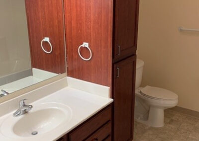 Interior bathroom space from Avalon Square featuring vanity and toilet