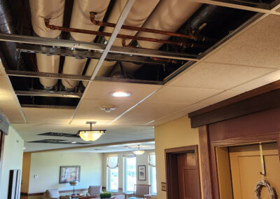 Exposed ceiling HVAC in a hallway of the Dickson Hallow facility