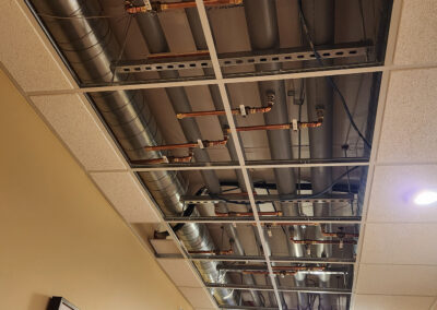 Exposed ceiling HVAC in a hallway of the Dickson Hallow facility