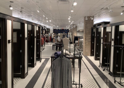 Interior retail space featuring various fitting room doors