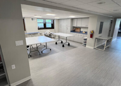 Interior common space featuring mobile tables and cabinetry from Eastcastle Place senior living facility