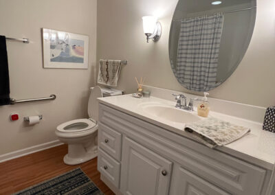 Bathroom space featuring toilet and vanity from Eastcastle Place senior living facility