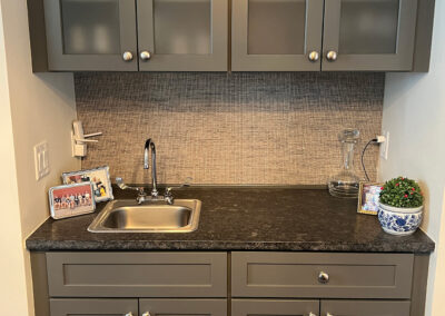 Interior space featuring small sink and shelving from Eastcastle Place senior living facility