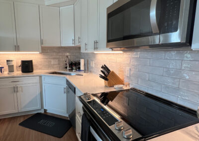 Kitchen space featuring an oven and microwave from Eastcastle Place senior living facility