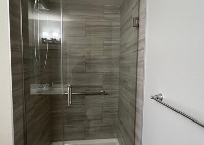 Shower space from Eastcastle Place senior living facility featuring towel rod