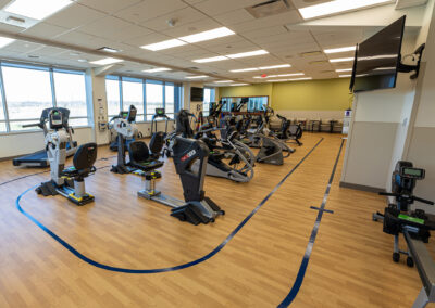 Fitness room at Froedtert West Bend featuring various pieces of exercise equipment