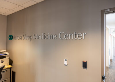 Aurora Sleep Medicine Center wall sign from a right angle viewing