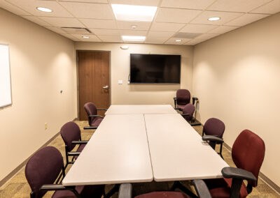 Meeting room featuring TV, tables, and chairs at the Aurora Sheboygan Sleep Lab