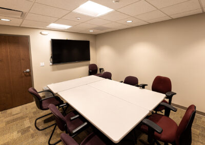 Meeting room featuring TV, tables, and chairs at the Aurora Sheboygan Sleep Lab