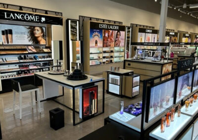 Interior retail display featuring makeup products at Macy's Highland Grove