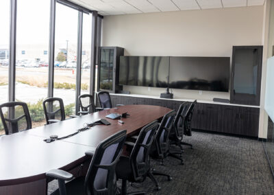 Meeting room featuring table, mobile chairs, and large picture windows at Westbrook MTE Tenant Buildout