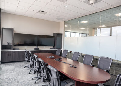 Meeting room featuring table, mobile chairs, and large picture windows at Westbrook MTE Tenant Buildout