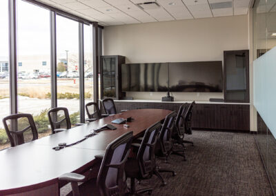 Meeting room featuring table, mobile chairs, and large picture windows at Westbrook MTE Tenant Buildout