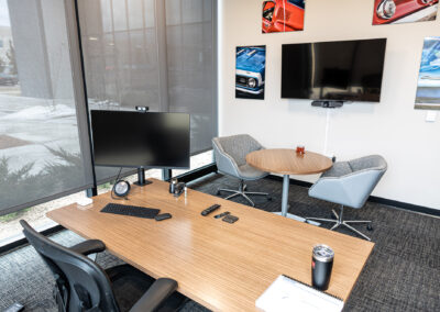 Office at the Westbrook MTE Tenant Buildout featuring small desk, chairs, table, and large picture windows