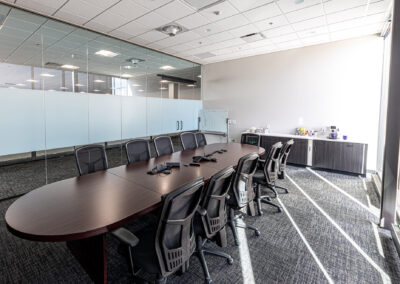 Meeting room featuring table, mobile chairs, and large picture windows at Westbrook MTE Tenant Buildout