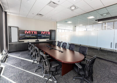 Meeting room featuring table, mobile chairs, and large picture windows at Westbrook MTE Tenant Buildout