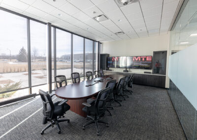 Meeting room featuring table, mobile chairs, and large picture windows at Westbrook MTE Tenant Buildout