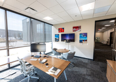 Office at the Westbrook MTE Tenant Buildout featuring small desk, chairs, table, and large picture windows